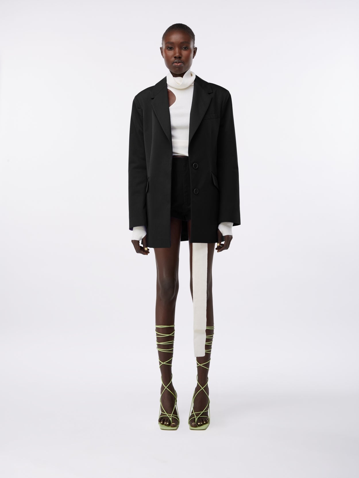 model wearing a black square blazer