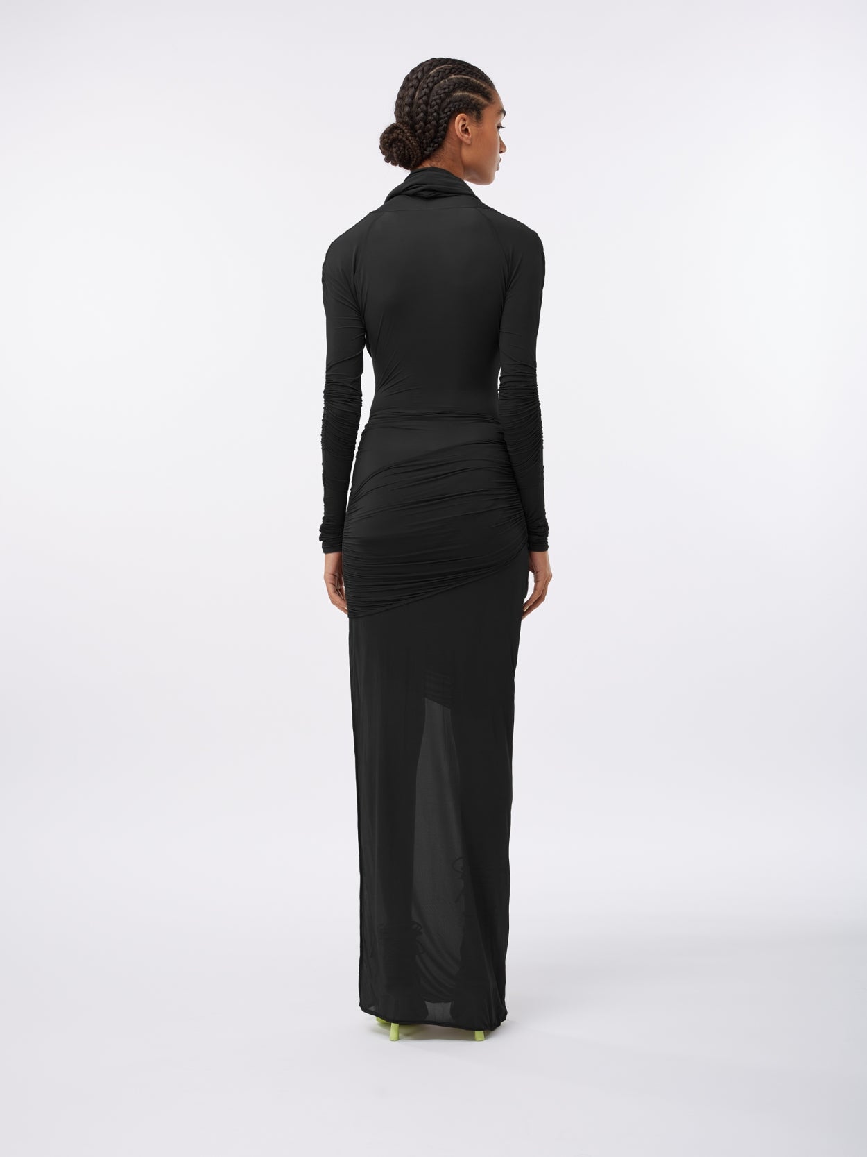 model wearing a black hooded jersey draped dress