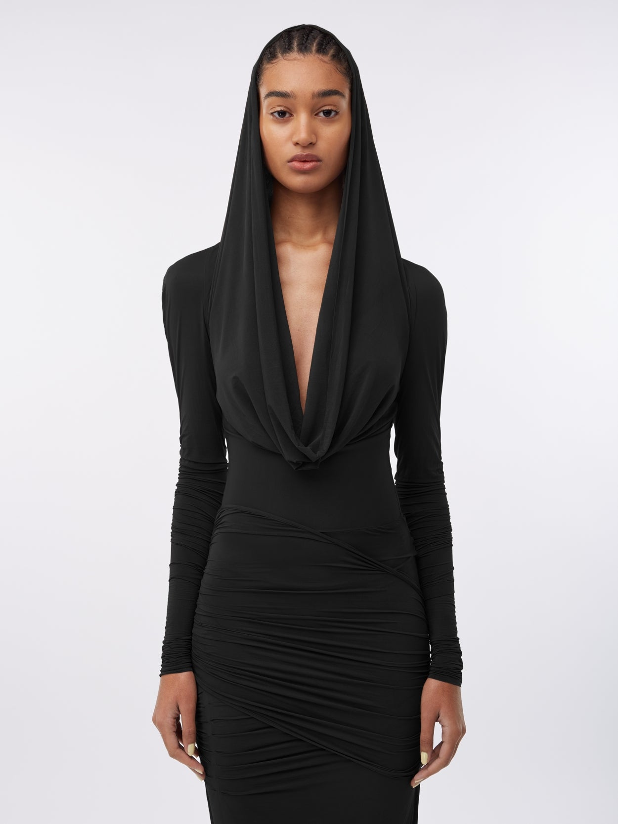 close up of a model wearing a black hooded jersey draped dress