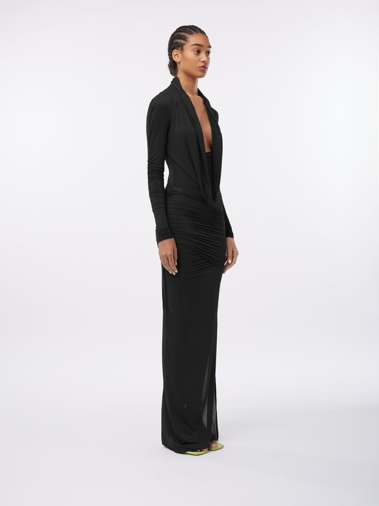 model wearing a black hooded jersey draped dress