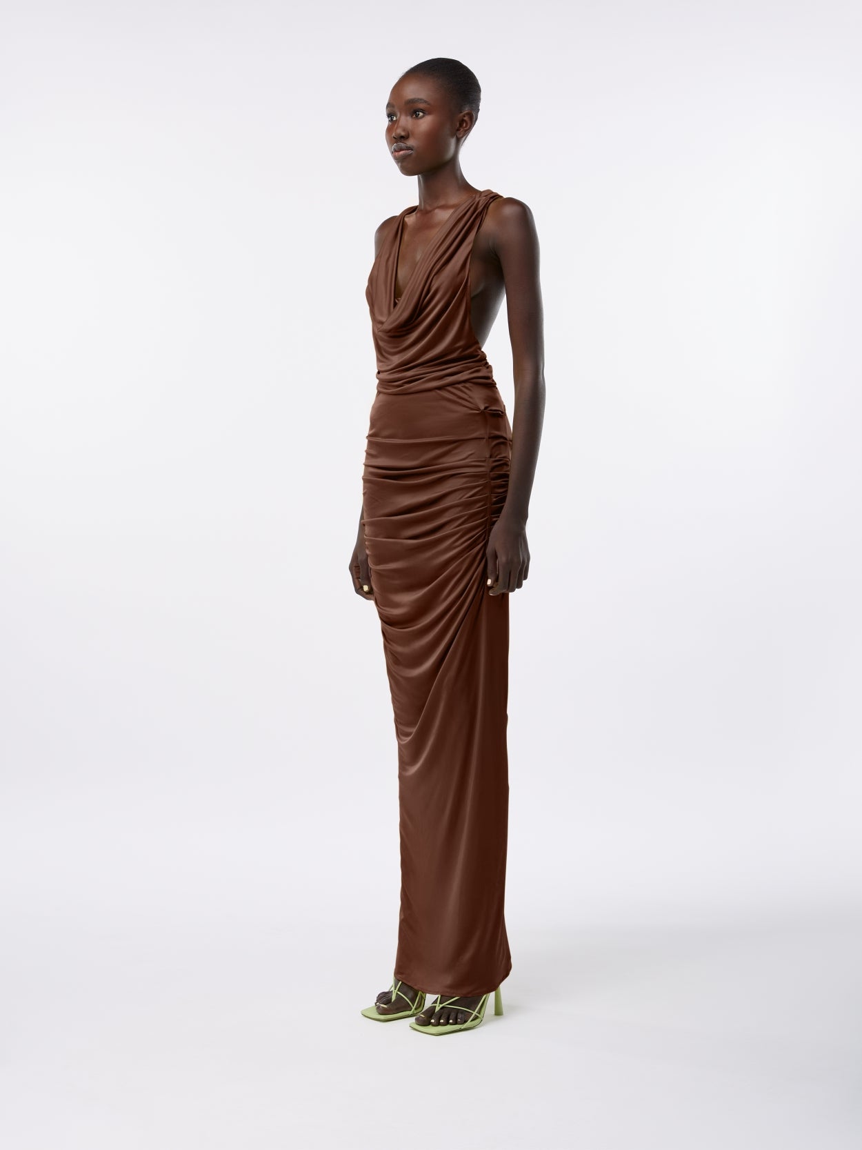 model wearing a brown long draped jersey dress