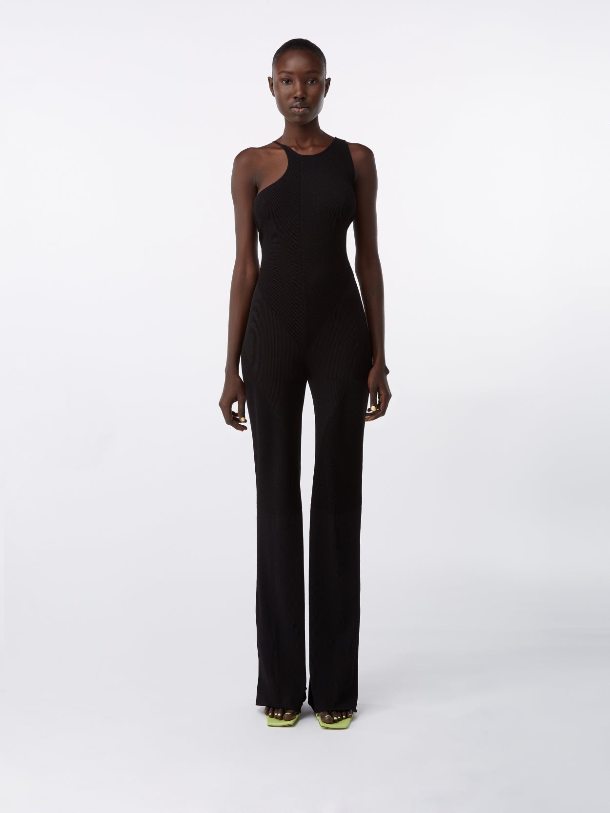 model wearing a black knit jumpsuit 